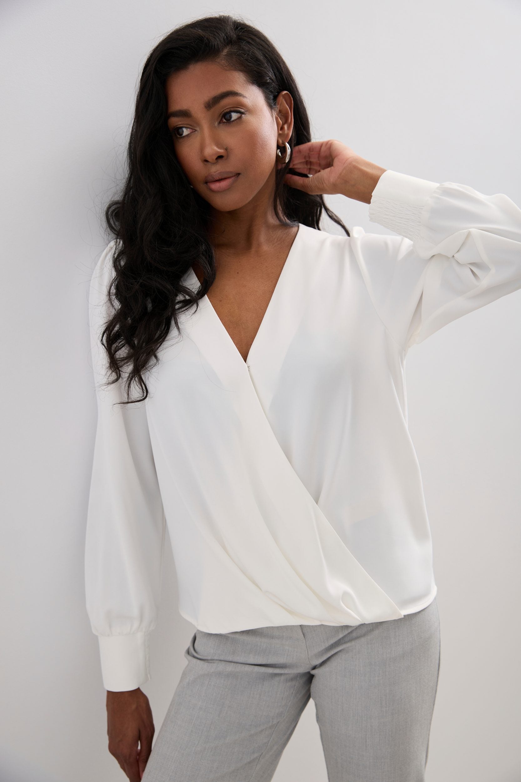 Long-sleeved blouse with a draped front