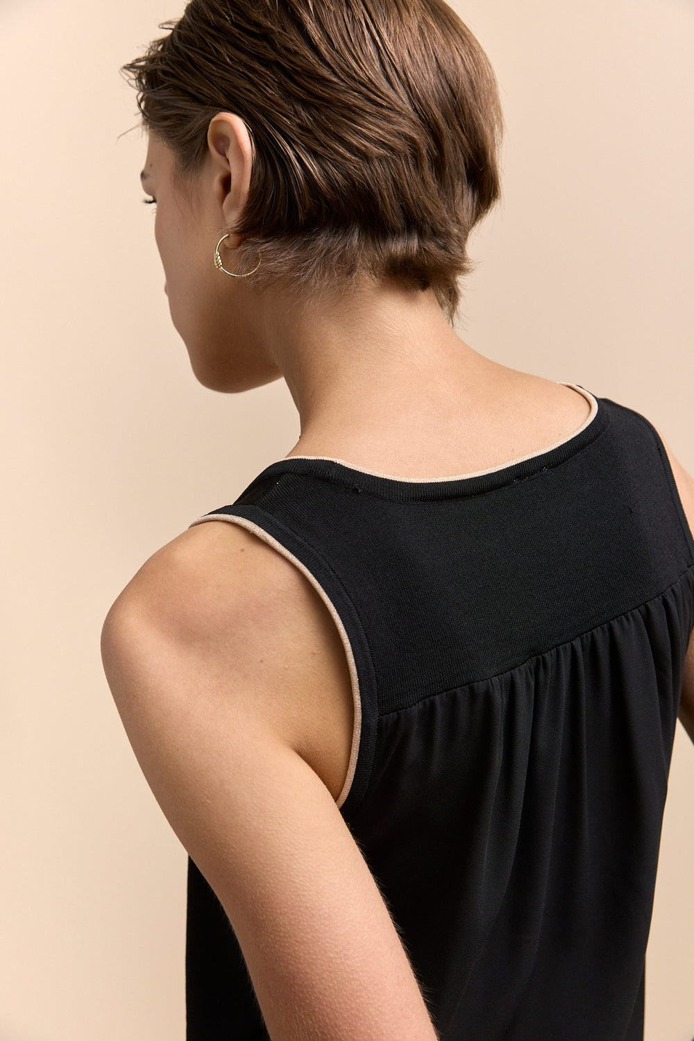 Sleeveless top with sheer back