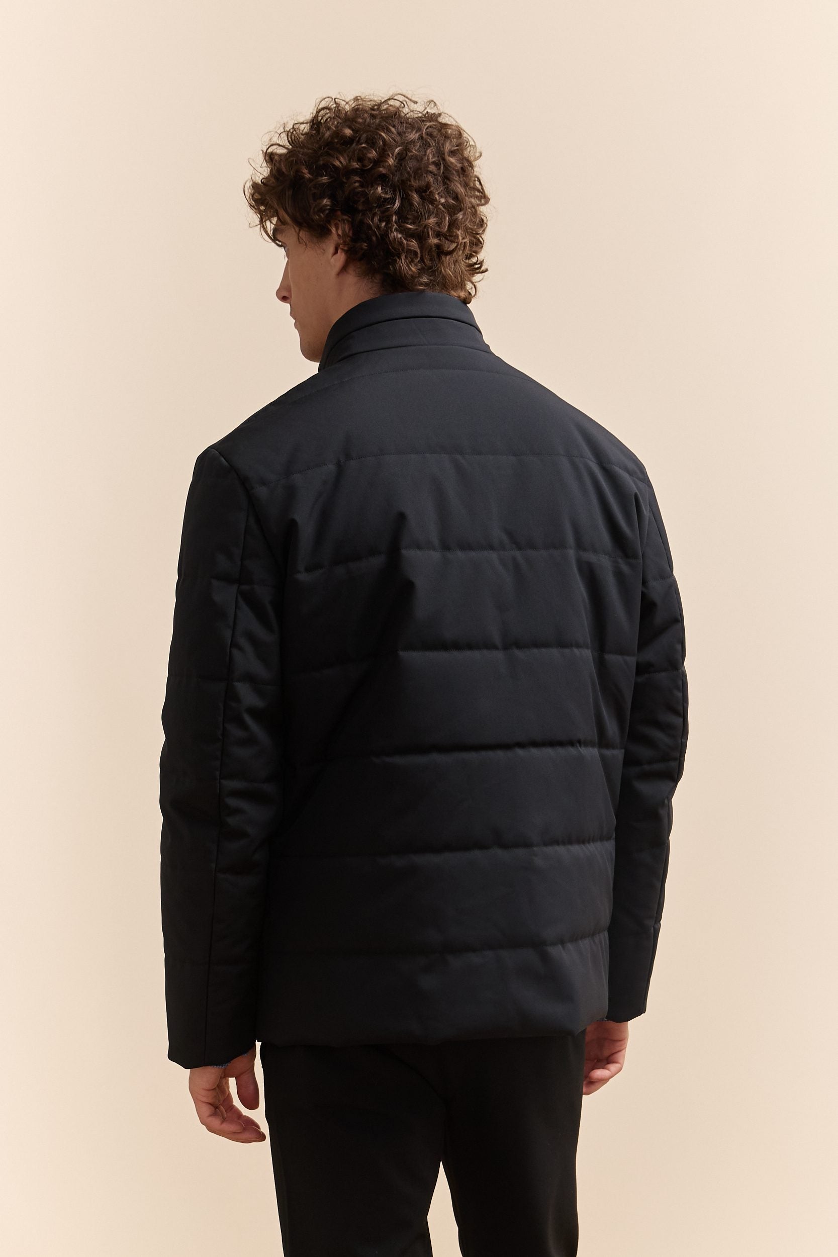 Quilted coat with zip closure