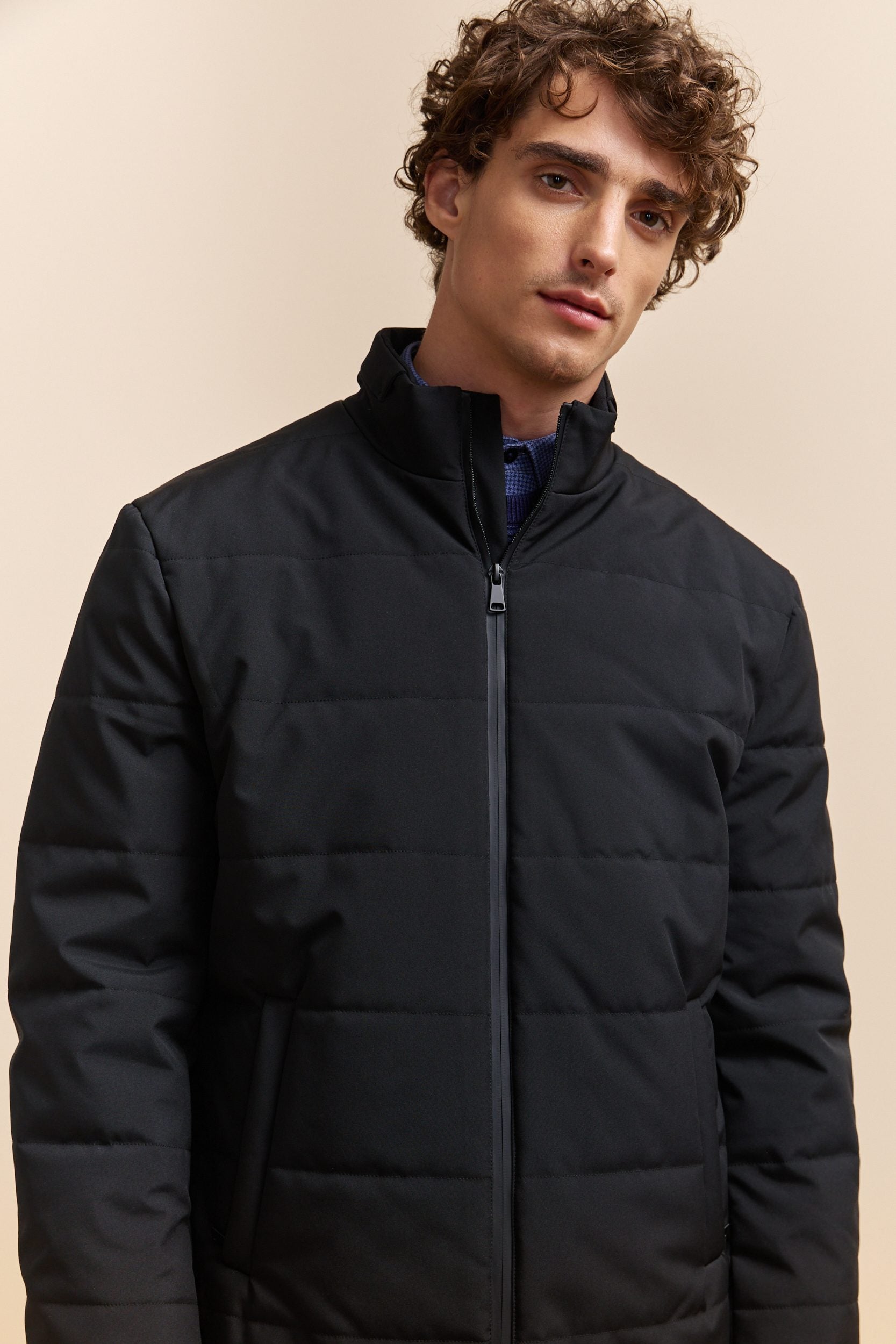 Quilted coat with zip closure