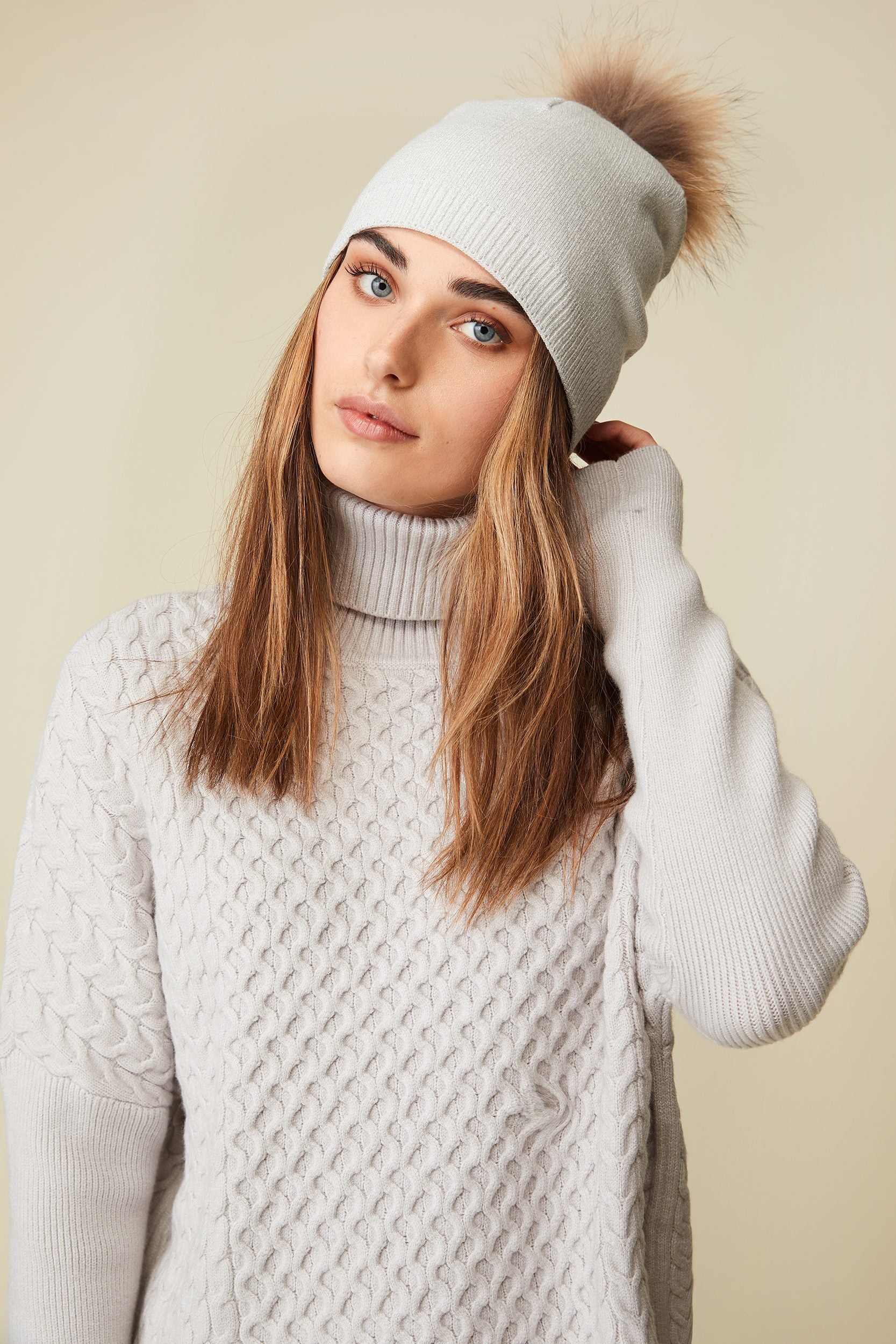 Metallic hat with removable fur pompom