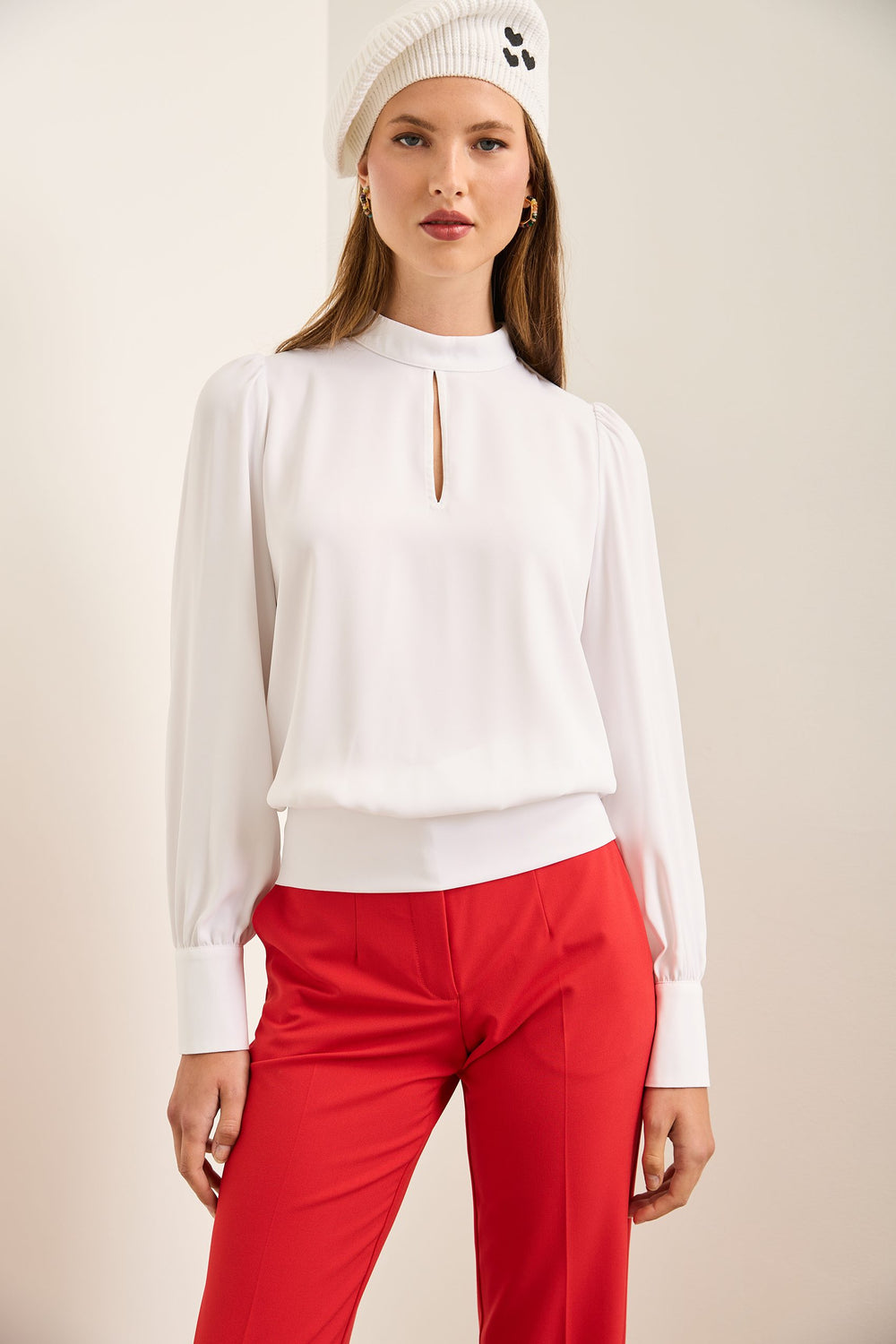 Blouse à col montant avec nid d'abeille