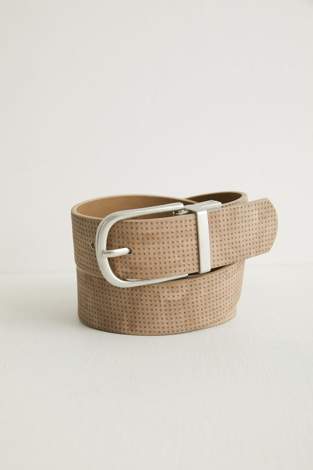 Perforated reversible belt