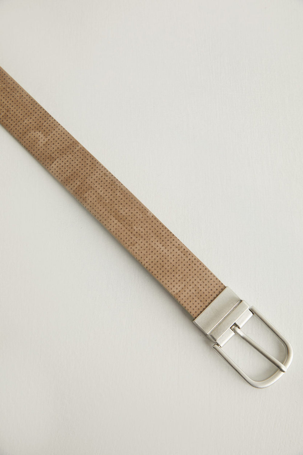 Perforated reversible belt